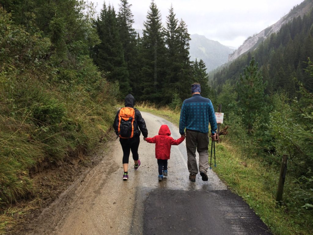 family hiking glacier national park