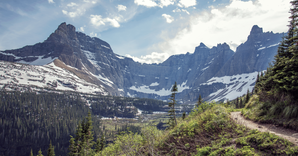 snow in the mountains in spring - glacier national park