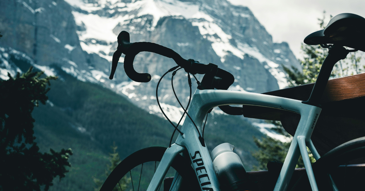 Blue Specialist bike with mountain in background in glacier national park