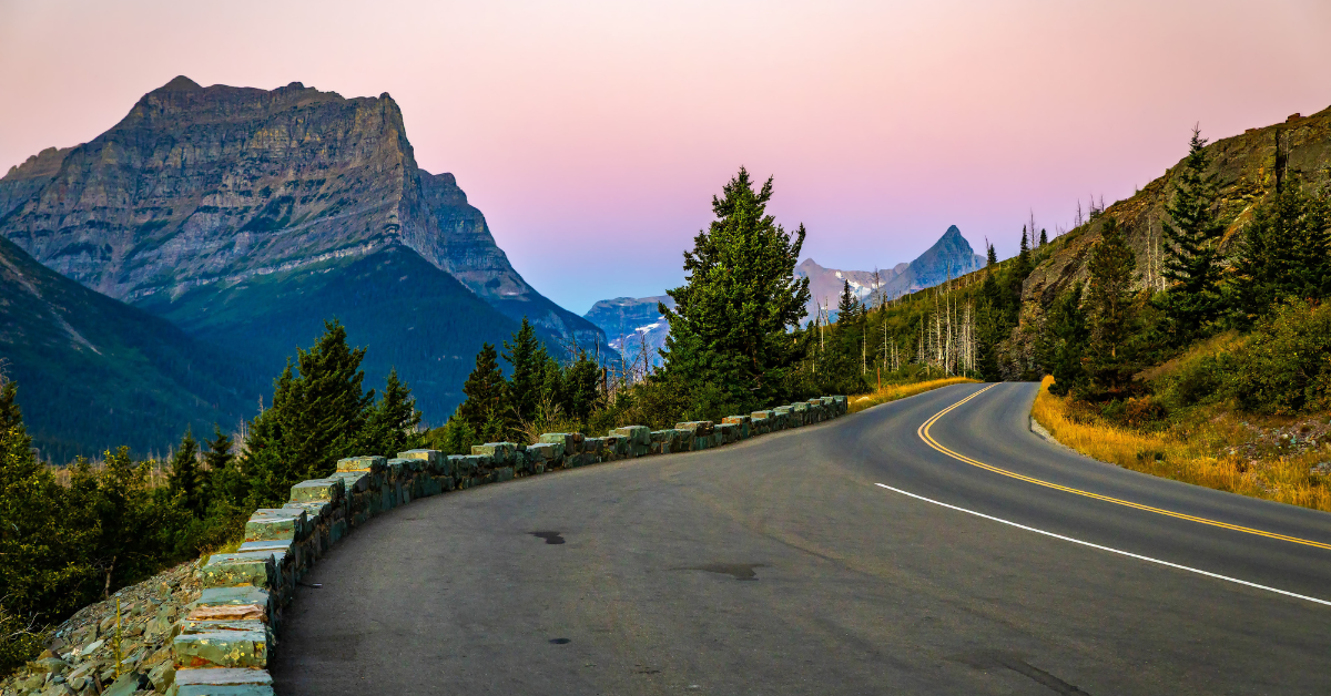 Winding Going-to-the-Sun Road with mountain view in the background.